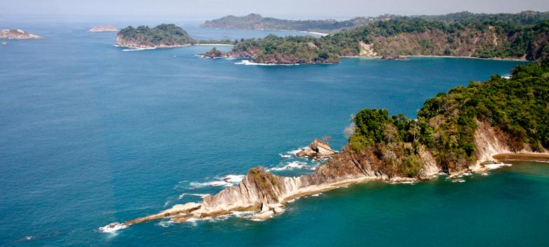 Location Surrounded by rainforest filled with monkeys and exotic birds, Puerto Quepos drapes itself across a tropical inlet surrounded by rainforest.