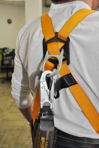 Make sure one end of the energy absorber is connected to the D-ring on the full-body harness. The other end will connect to the rope grab.