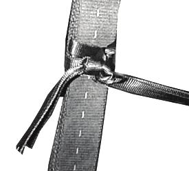 Route two lengths of the 1/2-inch tubular webbing through the plies of the sling from inboard to outboard about 3 feet.