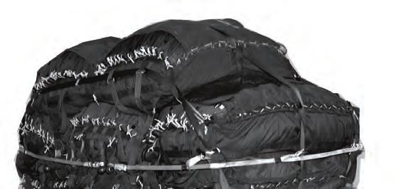 Cargo Parachutes 3 6 1 2 4 5 1 Run the first restraint strap up through the outside center carrying handles of the left bottom, middle, and top parachutes, across the top parachutes, and down through