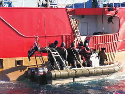 Australian Customs Service staff board the IUU boat, Viarsa, caught stealing Patagonian toothfish in the Southern Ocean in 2003.