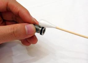 Lightly apply a small amount of DP-40 lubricant to the tip of a cotton swab. (SEE PIC A) F 3.