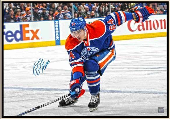 NAIL YAKUPOV SIGNED 20x29 CANVAS FRAMED OILERS POWERING FORWARD- This image of Nail Yakupov has been hand signed by the star