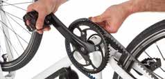 Locate both of the belt tension adjusters at the rear forks and, using the