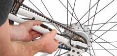 With your ebike upside down, tighten the nuts on either side of the wheel by