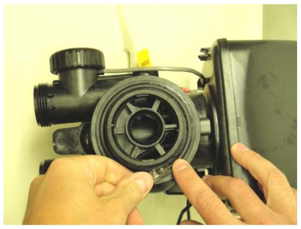 Installing the Clack WS1 Meter Control Valve: Using the included silicone lubricant packet, lubricate the inner and outer o- rings on the bottom of the Clack WS1 Meter Valve