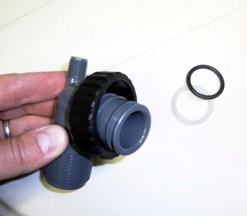 Repeat by pushing the split ring one side at a time across the plumbing adapter until secured into the second ring-sized groove.