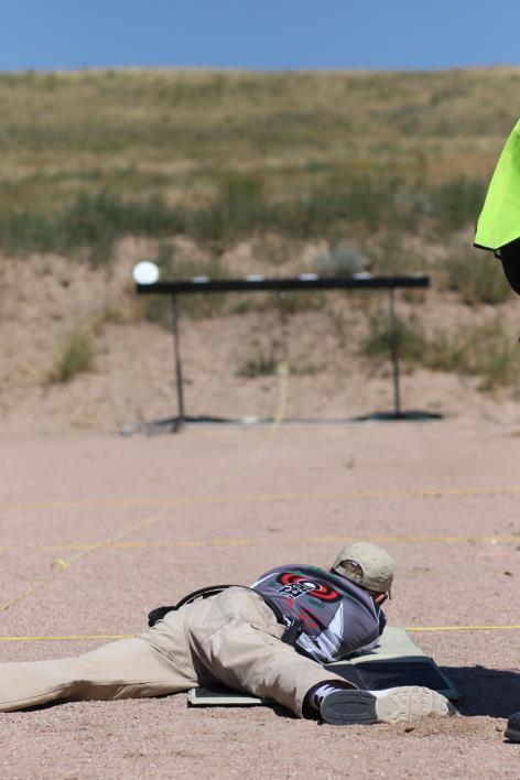 Falling Plates: Jonah Avenell from Columbia MO fires from prone position during the Falling Plates event.