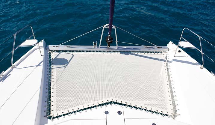 of the helm seat, with the mainsail and jib sheets brought aft to primary winches for easy