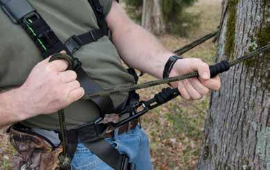 Clip the extra snap clip to the loop end of the safety rope and then to the sewn Linemans Loops attached to the harness as shown in figure 22. 2. Put the safety rope around the tree. 3.