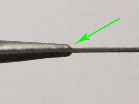 and a smoothly tapering ferrule, but its ferrule terminates abruptly, creating a 'bump' rather than a smooth transition from blade-face to ferrule.