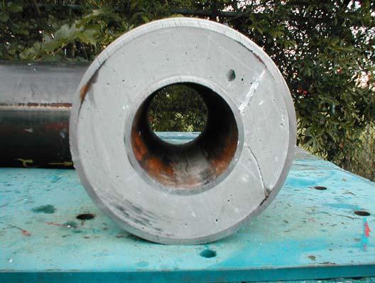 Once the cement is cured, the inner casing pressure was released, creating an annular void space between the inner casing and the cement sheath.