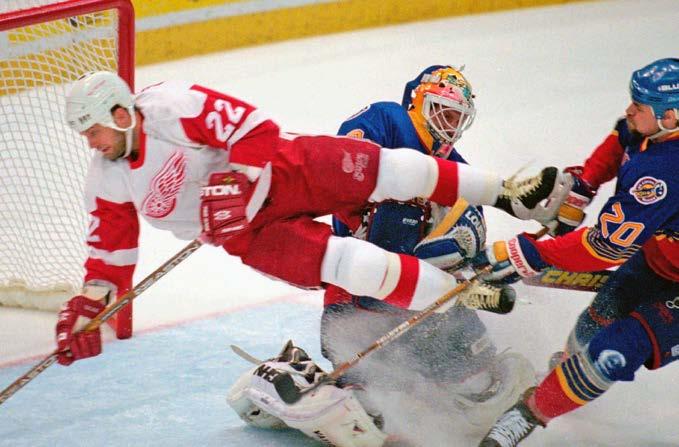 .. 14 The Best Game You Can Name... 15 Glossary.... 16 Red Wings player Dino Ciccarelli (22) is pushed into the Blues goalie John Casey during Game 7 of the Western Conference finals in 1996.