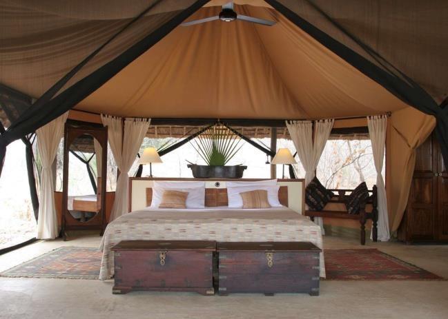 SIWANDU PRIVATE CAMP Sheltered in a grove of palms on the shores of Lake Nzerakera, part of the watery byways of the Rufiji River system, Siwandu is perfectly situated to fully experience the