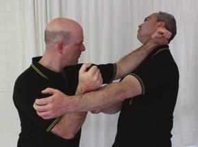 the defender seizes the wrist and attacks the arm, turning his opponent and enters with a forearm-strike to the jaw/ neck while smothering the attacker s attempted counter-strike.