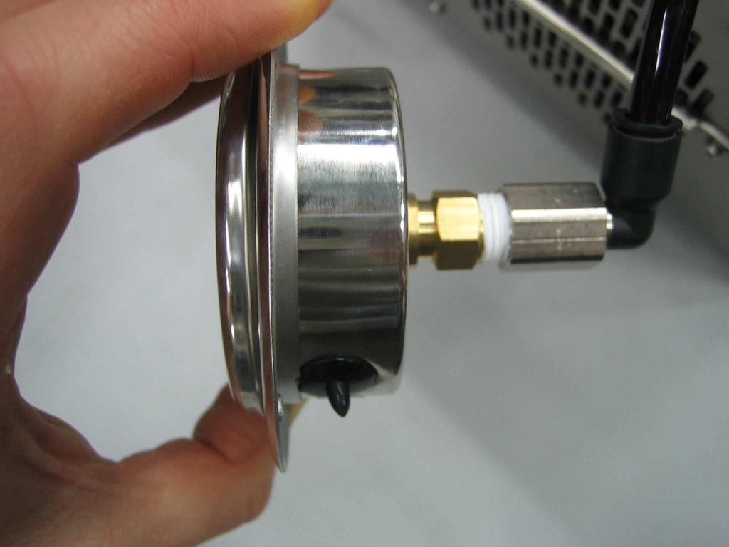 To install pressure gauge, push tubing firmly into the elbow fitting, performing a gentle tug