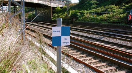 The sign shown below means there are no positions of safety or refuges on this side of the railway, but there are on the