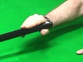 Allow one inch of the cue butt showing behind the grip hand.