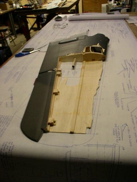 Top side view of right wing panel. The lower spar survived but the upper one did not. All the ribs were split so they were removed and will be replaced with new ones.