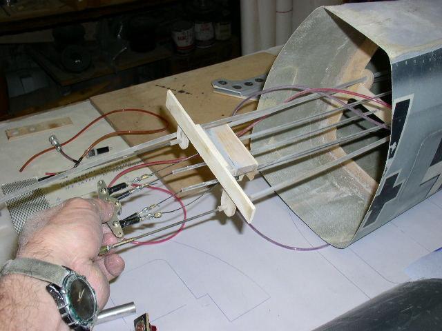 The tiller arm in my left hand is connected to the rudder and tail wheel using pull-pull cables.
