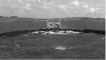 In comparison with traditional hydroelectric power stations, this new technology is competitive. Figure 10 shows a photograph of the Wave Dragon system installed near shore. Fig. 11 Power Buoy above the ocean surface.