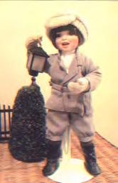 Quentin (holding lantern) - Selling as 4 doll "Sharing Christmas Joy" set - By Mary Tretter "Sharing Christmas Joy" 4 doll set (items 33-36) selling together as a set. Porcelain.
