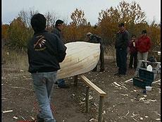 the canoe is removed from the bench and taken to Pien's