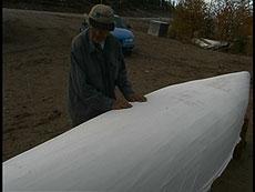 6. The Finishing New canvas being laid out on the hull