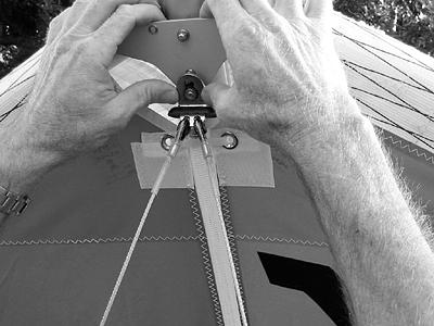 16. With the center zipper open, look inside the sail to preflight the following items: a.