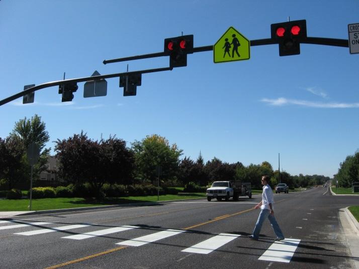 This alternative would provide a safer crossing for pedestrians and bicyclists across St.