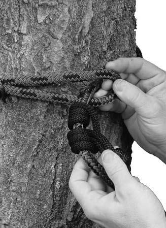 Thread the knot end and the adjustable prussic hitch all the way through the loop end of the safety rope (See Figure 12 again). Step 3.