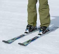 The ankle, knee, and hip show appropriate angles as the skis are tipped onto their edges and held throughout the turn.