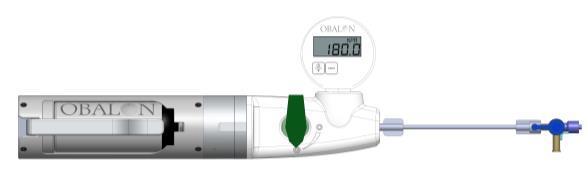 Insert the disposable EzFill Can into the EzFill Dispenser horizontally with the area where the cap was facing toward the digital gauge (Figure 6). FIGURE 6.