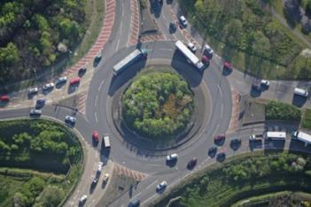 Roundabout Where pedestrians are present, sidewalks with a physical barrier are provided on