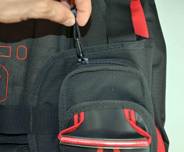 Then close the zippers, and ensure that the lower velcro closures are fastened closed (Fig. 12). Fig. 11 Fig. 12! WARNING: The maximum weight capacity for each weight release pocket is 5 lbs (2.