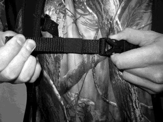 footwear removed, pick up bib harness by