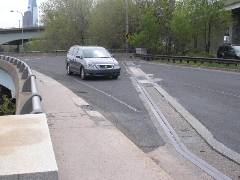 creating a blind curve leading to unsafe conditions that could cause a collision.