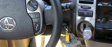 Insert the key (Black remote) into the key slot between the steering wheel and designated area and gear shifter 23.