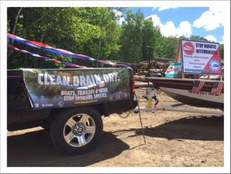 Truck and boat as AIS awareness float, Long Lake Fourth