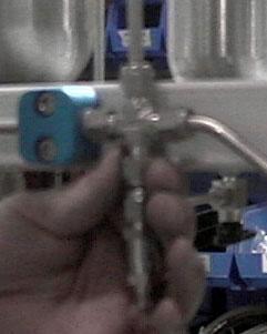 Unscrew the Swagelok nut located on the nitrogen manifold (Figure A-4) using a 9/16 wrench.