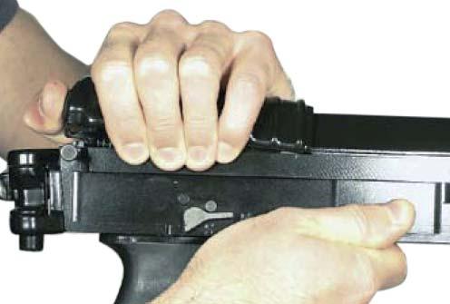 Fig. 27 Taking out the magazine b) Removing the return mechanism (Fig.