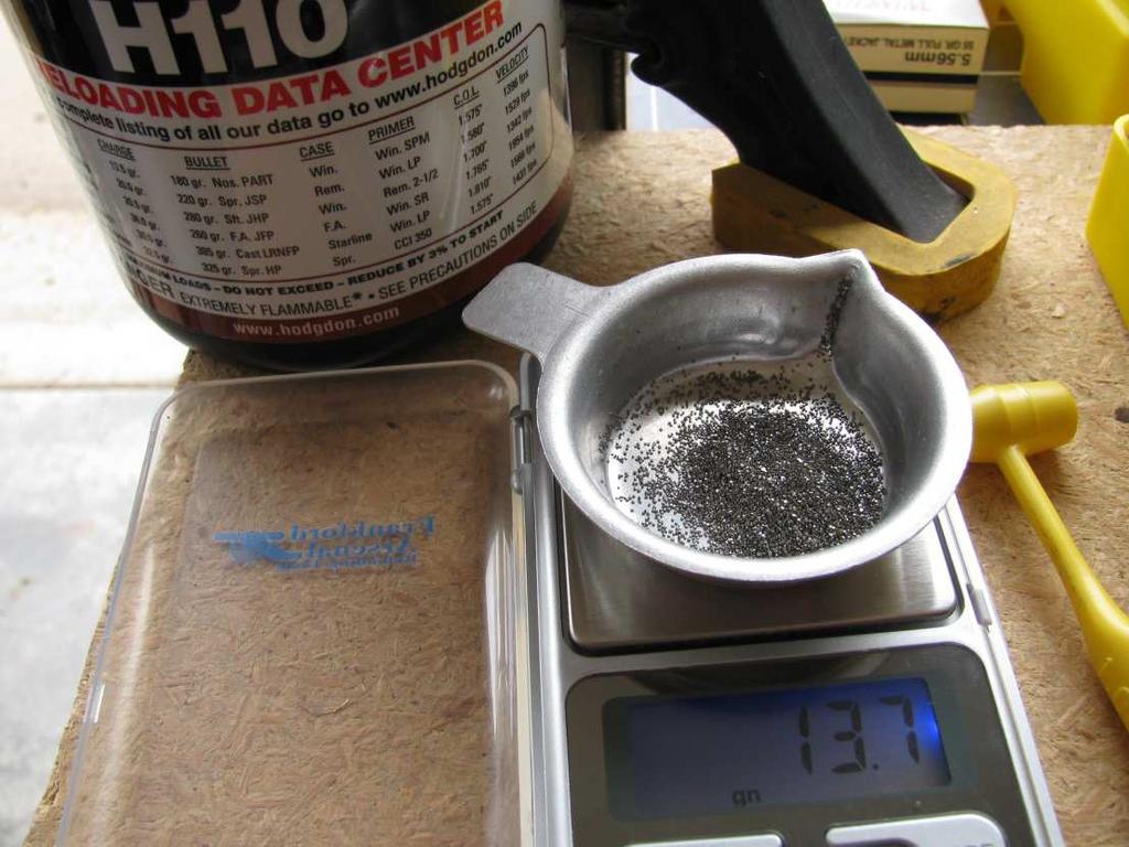 Figure 14 : 13.7 gr. of H110 on the Scale This is one of the 13.7 gr. loads (obviously) and that amounts to just under 1.0 cc using the Lee dipper.