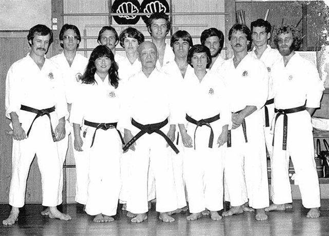 Moledzki Sensei [3rd from right] with Sakagami Ryusho low blocking position and my right hand against my right side around the top of my hip level feeling very awkward for a little while.