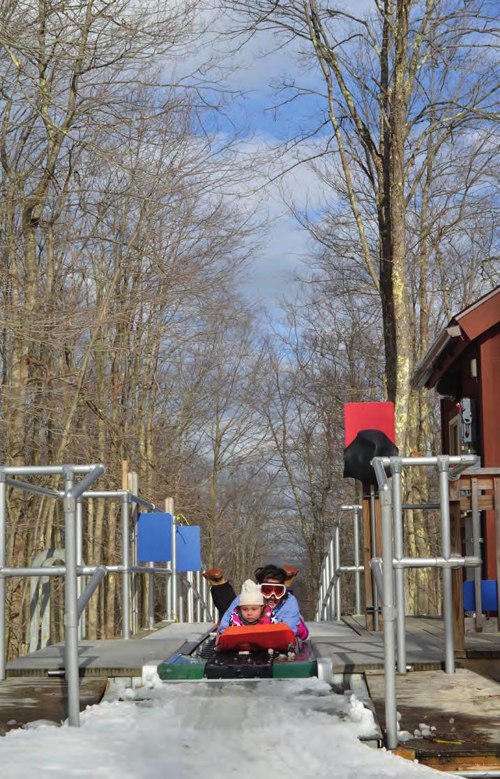 The 8-minute conveyor ride back to the top of the sled run at Blackwater Falls State Park gives riders of all ages a chance to relax and enjoy the wintery scenery.