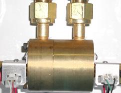 Description of Parts Piston Type (HIGH Pressure) The high pressure shuttle valve used for Nitrogen service is basically the same as the low pressure one, except for the replacement of the diaphragm