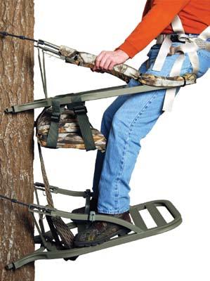 CLIMBING UP WITH YOUR NEW STAND (continued) 4. To begin climbing, raise your seat climber up to just below waist height and grasp the upright arms very firmly as shown in figure 34.