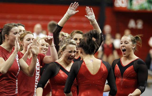 The Huskers celebrate after Emily Wong s 9.925 floor exercise routine against Iowa on March 4. and Centenary finishing fourth (190.425).