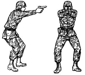 Place the feet naturally in a position that allows another step toward the target. Extend the weapon straight toward the target, and lock the wrist and elbow of the firing arm.