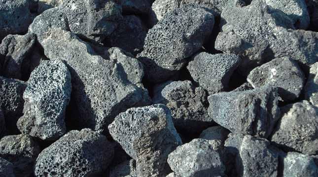 BOULDERS Black Lava Rock [this material is in baskets] Lava rock is formed when magma comes from the depths of the earth making its way to the surface in a volcanic rupture, resulting in a highly