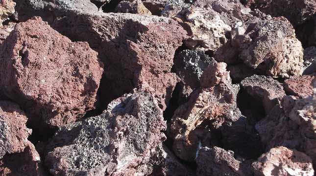 BOULDERS Red Lava Rock [this material is in baskets] Lava rock is formed when magma comes from the depths of the earth making its way to the surface in a volcanic rupture, resulting in a highly